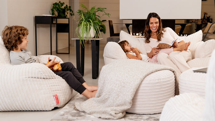 Family laughing on a cream cord bean bag
